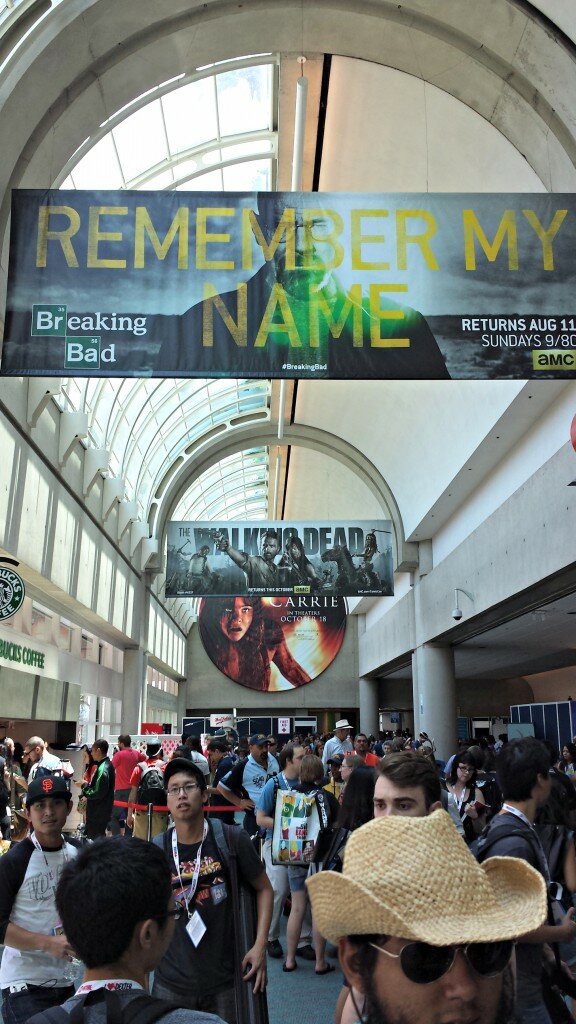 Inside the convention center entrance hall on day one: advertisements for film projects such as "Carrie" and TV shows like "The Walking Dead" and "Breaking Bad" line the ceilings.